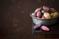 Colorful potatoes in a metal bowl — Stock Photo