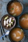 Bowls of miso soup with noodles and tofu — Stock Photo