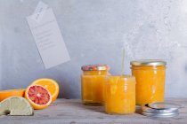 Orange marmalade in jars — Stock Photo