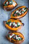 Sweet potatoes stuffed with kale, bacon and cheese — Stock Photo
