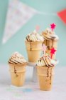 Ice cream cupcakes with vanilla frosting — Stock Photo