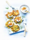 Courgette fritters with a cream cheese topping and smoked salmon — Stock Photo