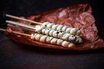 Vegan puff pastry with sesame seeds on sticks — Stock Photo