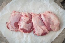 Fresh Duroc pork cheeks on a piece of paper — Stock Photo