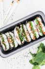 Sushi sandwiches with spinach, peppers, mange tout, black sesame seeds, colourful carrots, shiitake mushrooms and peanuts — Stock Photo