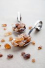 Brown rock sugar on spoons — Stock Photo