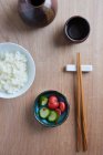 Rice and pickled cucumbers and radishes (Japan) — Stock Photo