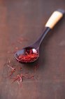 Saffron threads on a spoon — Stock Photo