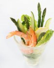 Shrimp cocktail with green asparagus and cucumber — Stock Photo