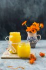 Marigold ointment in screw top jars — Stock Photo