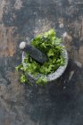 Fresh parsley in mortar — Stock Photo