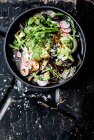 A green salad with radishes, spring onion and tahini — Stock Photo