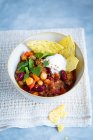 Chili con carne with beans and chickpeas in a small bowl — Stock Photo