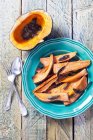 Roasted butternut squash and sweet potatoes garnished with sage — Stock Photo