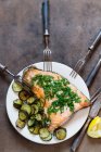 Salmon with herbs and zucchini slices — Stock Photo