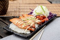 Grilled Salmon Teriyaki served with plain rice, pickles and salad — Stock Photo