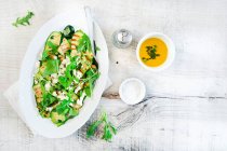 Grilled zucchini with feta cheese herbs and rocket — Stock Photo
