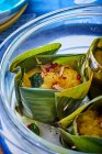 Fish amok in a banana leaf (traditional Cambodian seafood curry) — Stock Photo