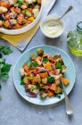 Roasted pumplin, sweet potatoes and brussel sprouts salad with croutons — Stock Photo