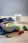 Green smoothie bowl with kiwi — Stock Photo