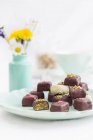 Chocolate pralines with pistachios and marzipan — Stock Photo