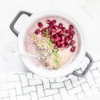 Buckwheat porridge with acai berries, pomegranate, matcha, lavender and almond mousse — Stock Photo