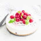 Cheesecake with raspberries and basil — Stock Photo