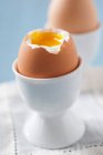 Soft boiled egg in egg cup, close up — Stock Photo