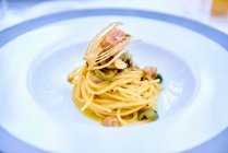 Spaghetti with tuna and green olives, close up shot — Stock Photo