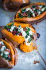Sweet potatoes stuffed with kale, bacon and cheese — Stock Photo