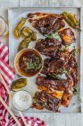 Short beef ribs with barbecue sauce and chipotle peppers — Stock Photo