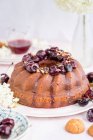 Semolina bundt cake with cherry compote — Stock Photo