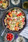 Noodle salad with Kritharaki, tomatoes, cucumbers and olives (Greece) — Stock Photo