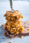 Grilled chicken and cheese sandwiches with buffalo sauce — Stock Photo
