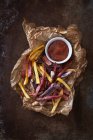 Oven baked colorful fries (seen from above) — Stock Photo