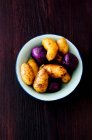 A selection of potatoes  Linda, Blue Congo and Vitelotte — Stock Photo