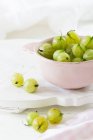 Green gooseberries in a bowl — Stock Photo