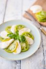 Caprese with green tomatoes and basil — Stock Photo
