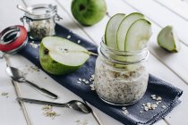 Muesli with pear slices in a glass jar — Stock Photo