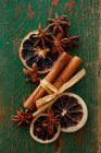 An arrangement of spices with star anise, cinnamon and dried orange slices — Stock Photo