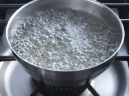 Sugar boiling in a bowl — Stock Photo