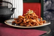 Filipino style deep fried crispy squid glazed with chilli honey and garlic — Stock Photo