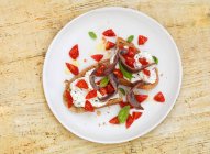 Spanish anchovy salad on cream cheese bread - foto de stock
