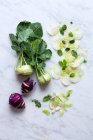 Fresh green and white radish on a wooden background. — Stock Photo