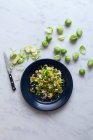 Brussels sprout salad with nuts — Stock Photo