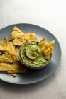 Mexican nachos with guacamole sauce and salsa — Stock Photo