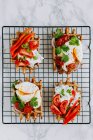 Savoury waffled with poached eggs and vegetables — Stock Photo