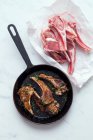 Fried lamb chops in a pan — Stock Photo