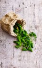 Fresh green beans on wooden background — Stock Photo