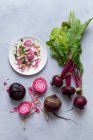 Fresh beetroot and beet salad on a gray background. top view. — Stock Photo